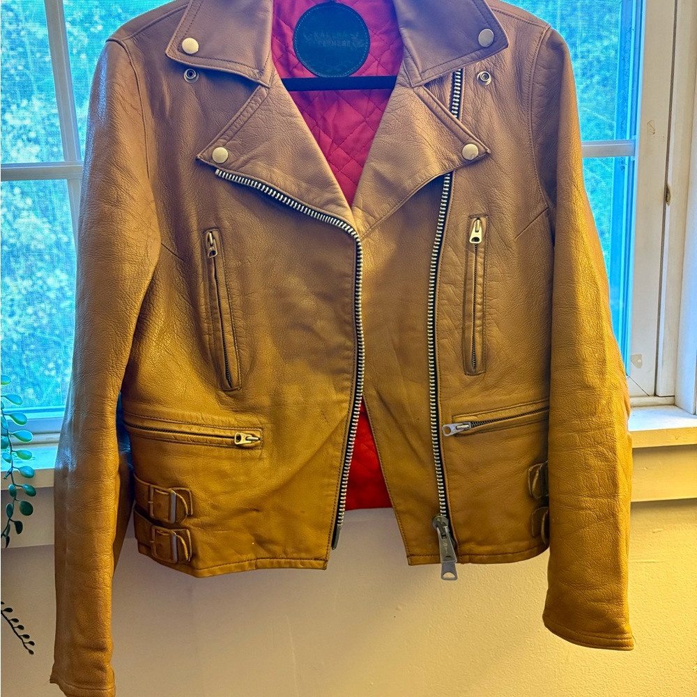 Tan Leather Biker Jacket and it has pockets.